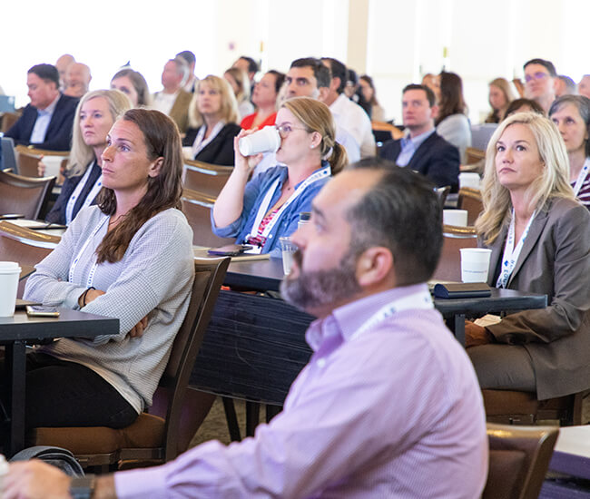 Picture of a crowd of audience members at an Equilar Event